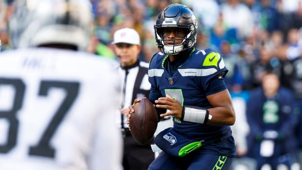 Nov 27, 2022; Seattle, Washington, USA; Seattle Seahawks quarterback Geno Smith (7) looks to pass against the Las Vegas Raiders during the first quarter at Lumen Field.